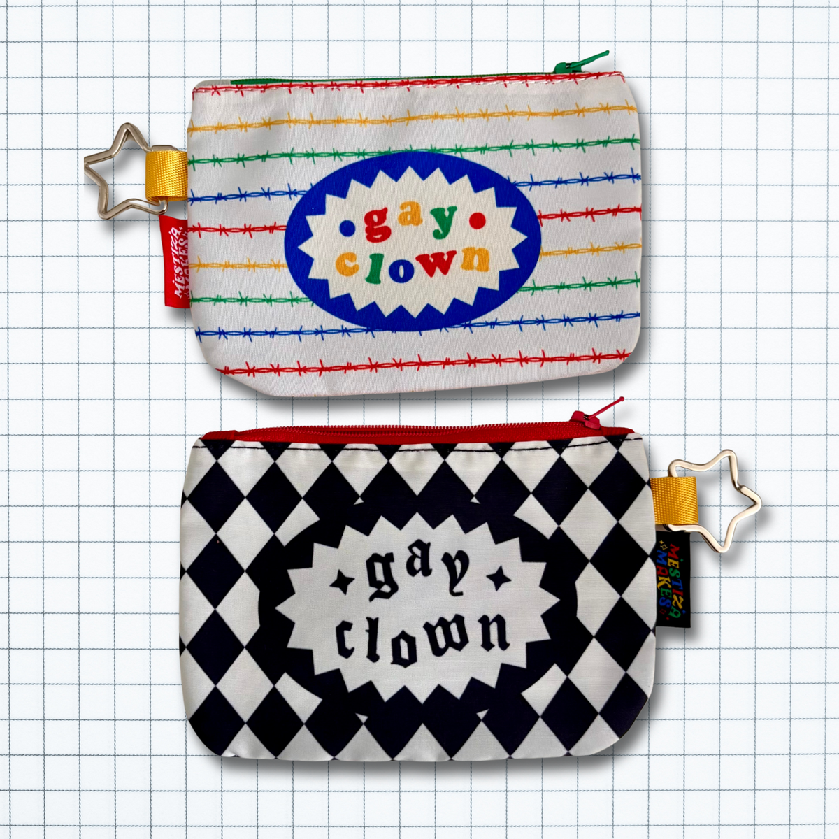 Two small zip pouches shown on a white grid background. The top pouch has a white base with primary colored rows of barbed wire, a blue oval center with the words 'gay clown' in rainbow bubbly letters, and a star keyring attached to it. The bottom pouch has a black and white harlequin diamond pattern with a black oval center with the words 'gay clown' in black gothic letters, and a star keyring attached to it.